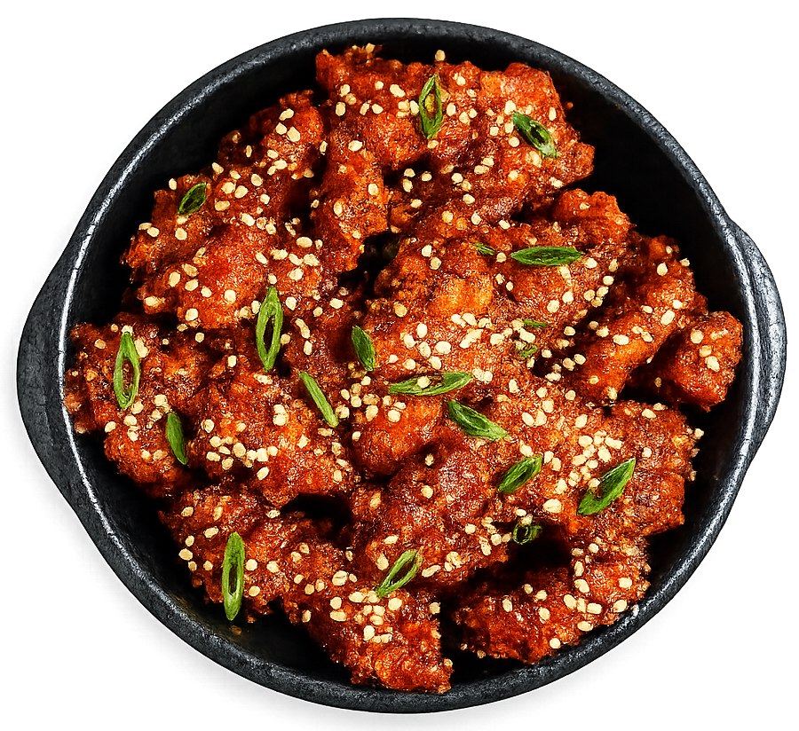 Spicy gochujang karaage kip met sesam en lente-ui bij Gyoza Bar
