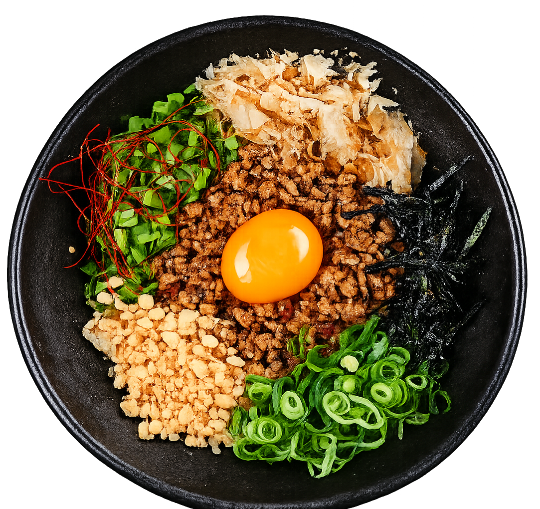 Mazemen ramen met gehakt, eidooier, lente-ui en toppings bij Gyoza Bar